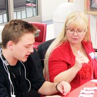 Lariena Nokes/Collegian - Margy Downard, a Dillons manager from Hutchinson, interviews HCC student Jared Rogers, Kansas City, at the HCC Jobs Fair