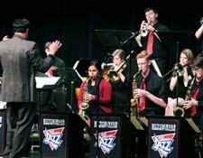 Angela Lingg/Collegian - Nick Schroeder directs the Hutchinson Community College Jazz Band on the evening of Friday, Nov. 13. The Jazz Band was accompainied by the Jazz Choir for their annual fall showcase held at B.J. Warner Recital Hall in the Stringer Fine Arts Center.