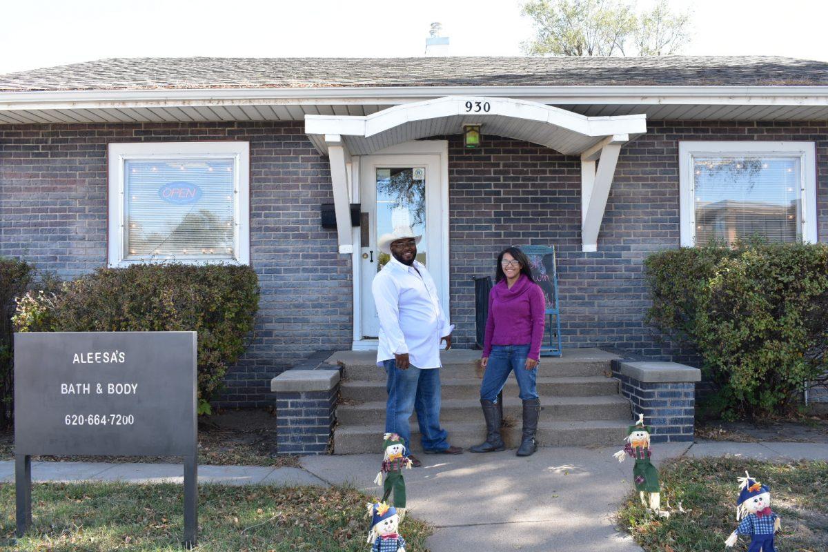 Mike Jobe and his daughter Alexia pose outside Aleesa's Bath & Body in Hutchinson