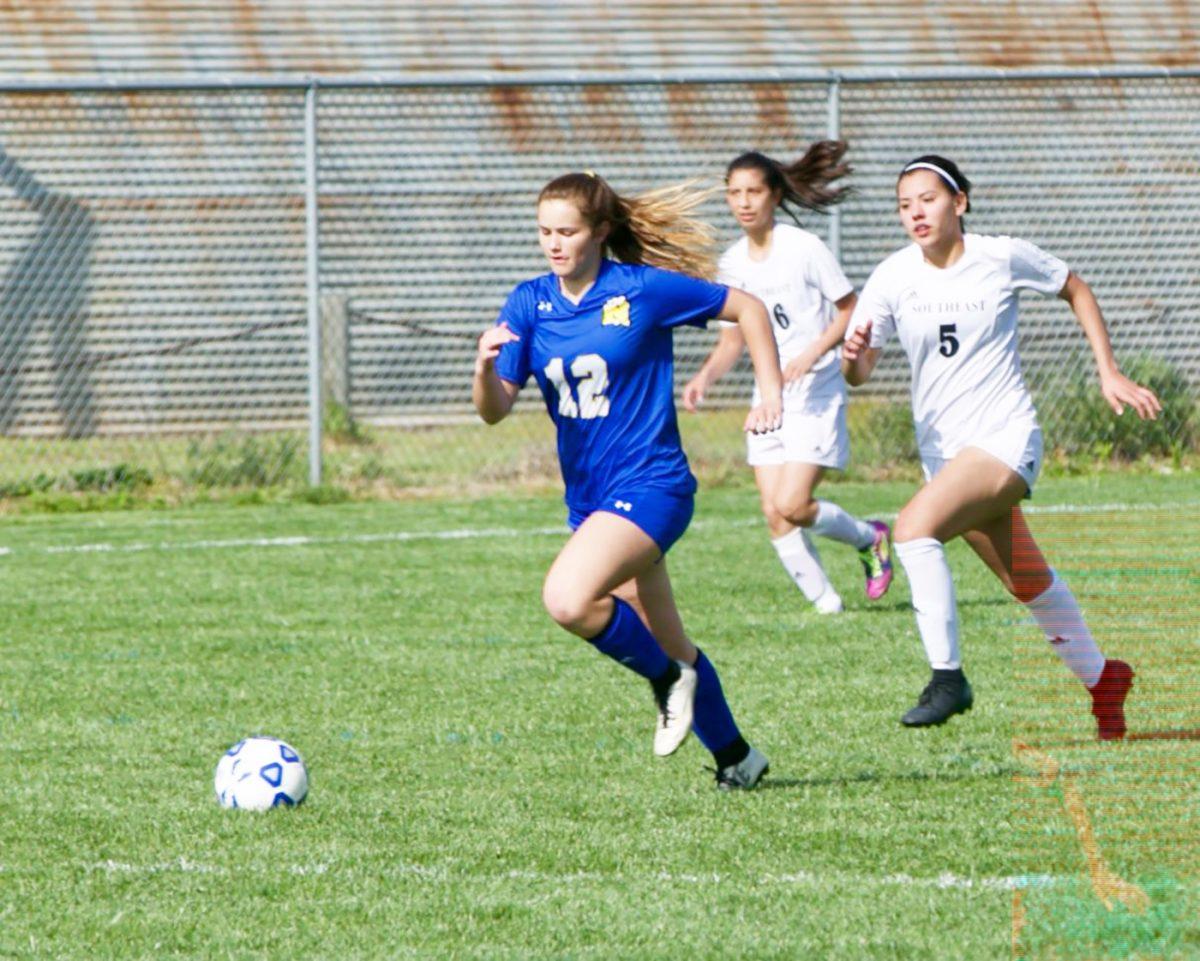Madison Ontjes dribbles down the field during a 2019 high school soccer game.