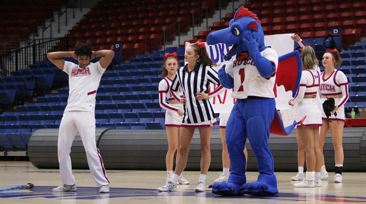 Jahim Ross, left, begins a routine under the watchful eye of Taylor Pickering (center) and Duke the Dragon.
