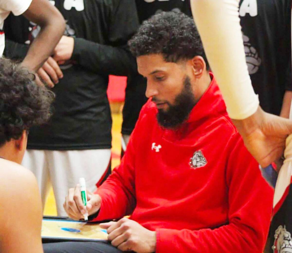 Former Hutchinson Community College basketball player AJ Spencer coaches his team at Wyandotte High School during a game earlier this season.