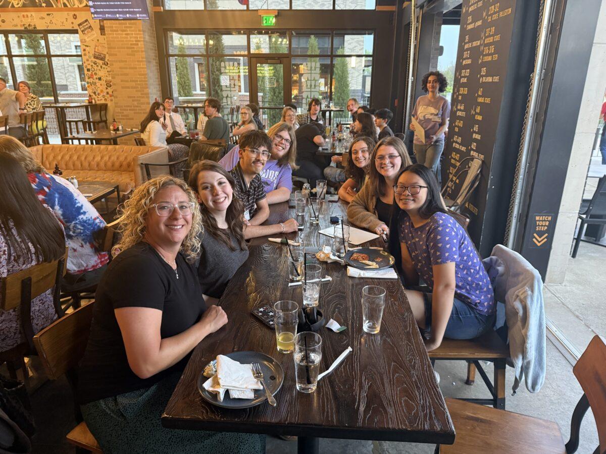 Amber Brawner (left) enjoys an evening with student publications' students at The Tap House in Wichita during the annual Kansas Collegiate Media Conference at Wichita State. 