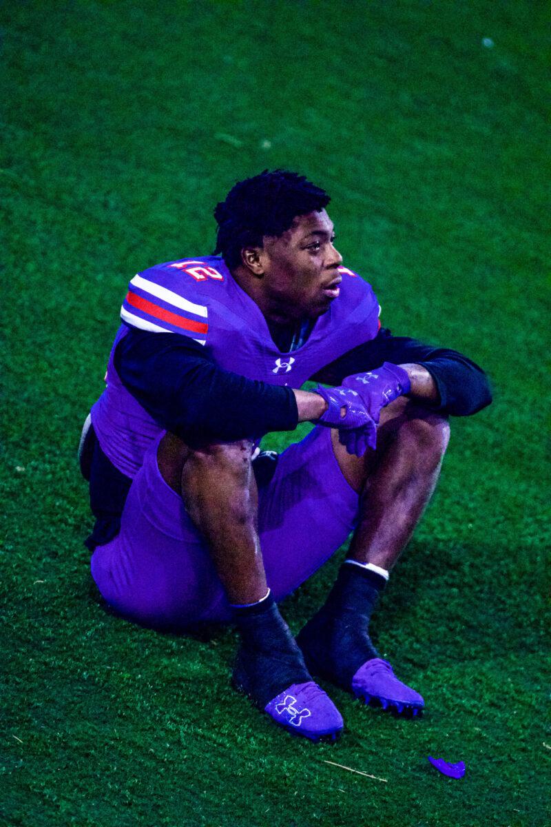 Johnathan Boyd fights back tears on a hill behind an end zone on Dec. 17 at Bain-Schaeffer Buffalo Stadium in Canyon, Texas. The Blue Dragons lost to Iowa Western 28-10. Photo by Reyna Sanchez/Collegian