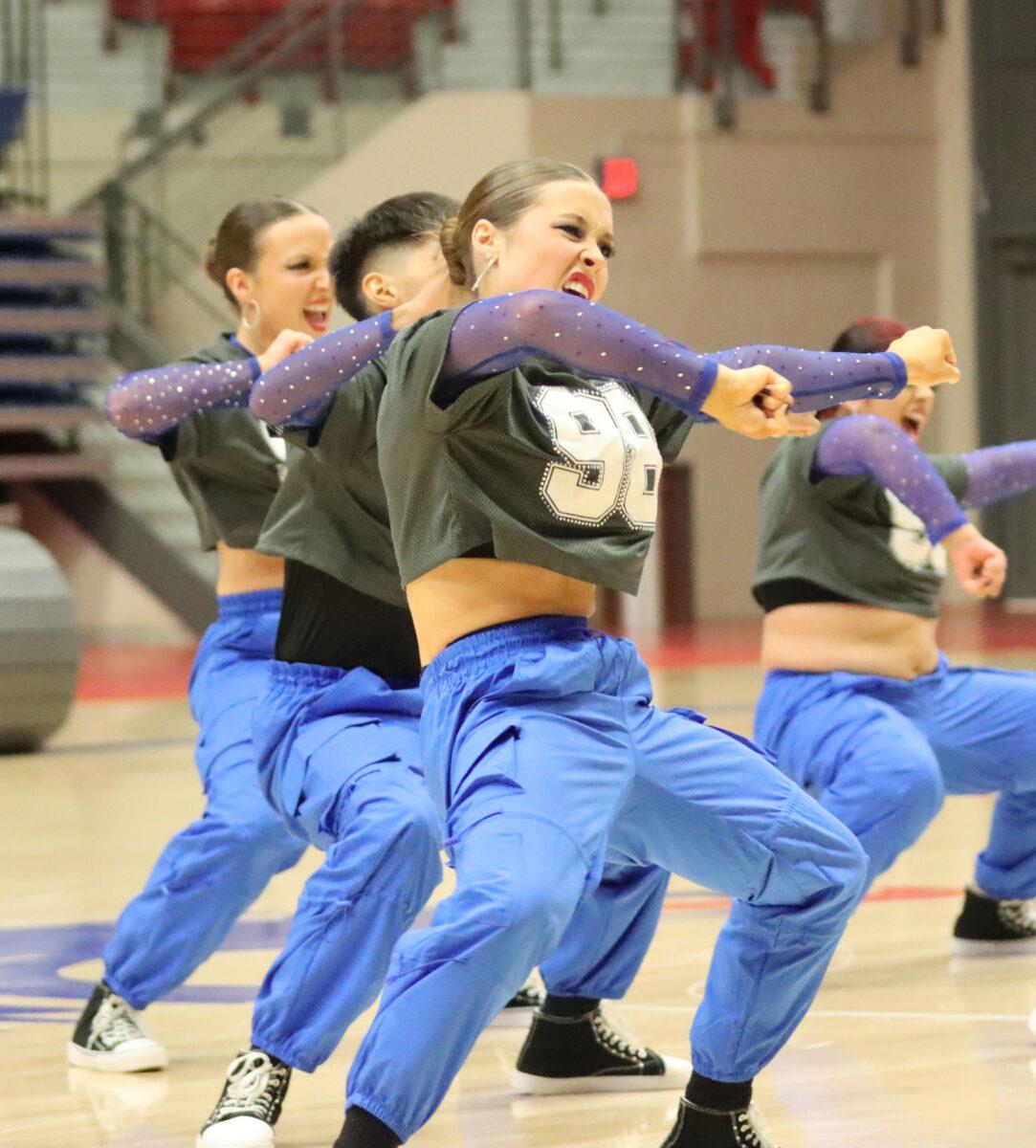 Paxton Landry leads a dance for the Blue Dragon Dragon Dolls on Saturday at the Sports Arena.