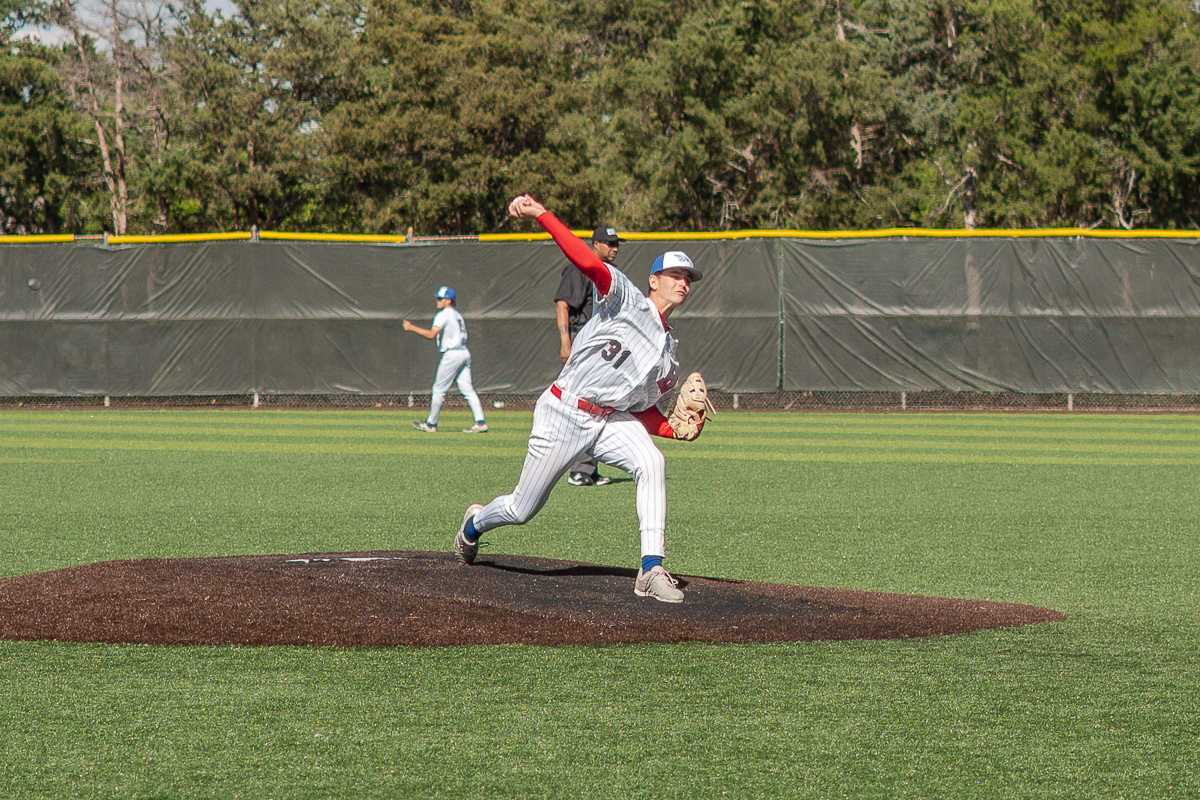 Brayden Henry throws a warm-up pitch on April 18 at Hobart-Detter Field.