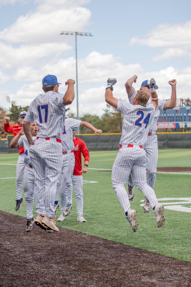 Blue Dragon baseball players celebrate a home run during an April 18 win against Seward County at Hobart-Detter Field.